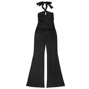 Detail view of black halter jumpsuit showing neck bow and wrap design with flared legs