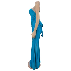 Detail view of peacock blue mermaid dress showing silky elastic fabric texture