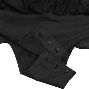 Detailed macro view of high-quality snap button closure on black mesh bodysuit crotch