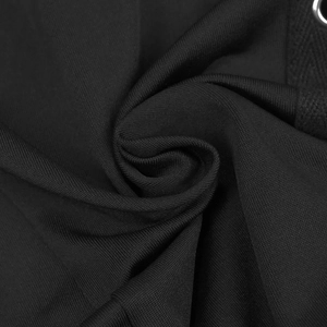 Detailed macro view of black ribbed knit fabric with metallic eyelets and woven drawstring