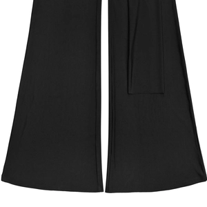 Detail view of smooth black wide leg jumpsuit fabric hem with matte finish texture