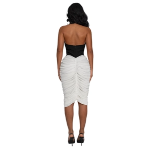 Detail of elegant backless halter neck design with sophisticated pleated texture contrast