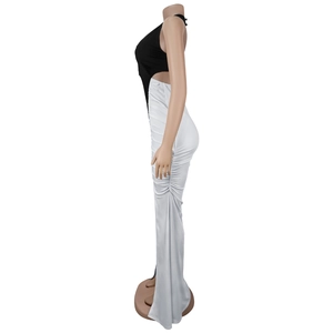 Detail of slim-fit backless halter dress featuring side ruching and a thigh-high side slit