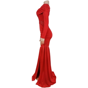 Detail of red evening dress featuring sheer mesh waist patchwork and a high side slit