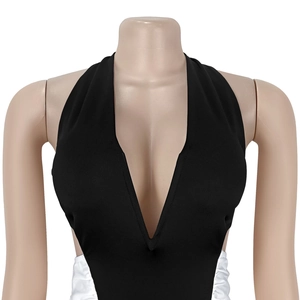 Detail of sexy deep V-neck halter dress with white ruched side panels in black stretch fabric