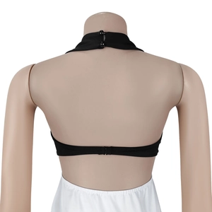 Detail view of black halter neck top featuring double button and back buckle closure