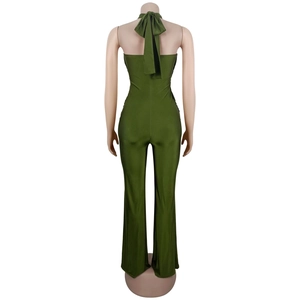 Detail of army green halter jumpsuit featuring an elegant open back and large bow tie closure