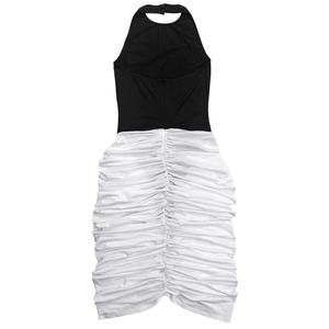 Detail of ruched white skirt with black halter neck on a two-tone contrast dress