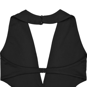 Detail of black halter dress back with triangular cutout and metallic clasp closure