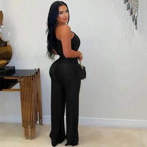 Detail view of black one-shoulder slim jumpsuit with wide leg design and stretch fabric