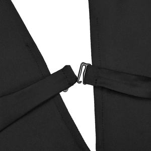Close-up of black dress back with elegant S-shaped metal hook and knit fabric texture