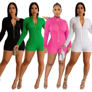 Women's long sleeve bubble texture romper with V-neck zipper in four vibrant colors