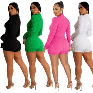 Detail view of slim-fit long-sleeve jumpsuits in popcorn fabric with four color options