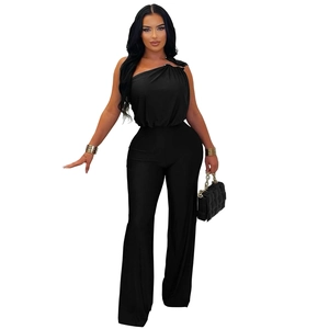 Detail of elegant black one-shoulder jumpsuit with pleated strap and high waist design