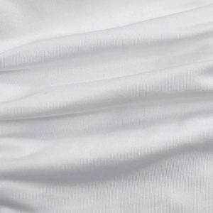 Detailed close-up of white knitted fabric texture with subtle ribbed patterns and soft folds
