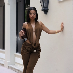 Detail of dark brown satin halter top and trousers with rhinestone buckle decoration