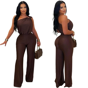 Detail view of dark brown one shoulder jumpsuit with wide leg design and pleated bodice style