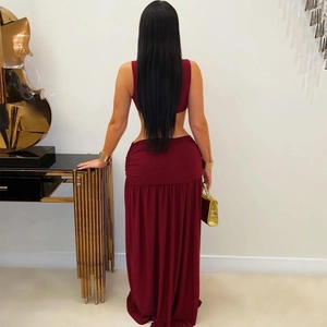 Detail of burgundy two-piece set featuring backless crop top and ruched maxi skirt