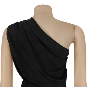Detail of black one-shoulder jumpsuit with elegant draped pleats and silky fabric finish
