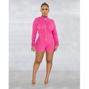 Detail of rose pink long sleeve romper with high-collar zipper and 3D bubble texture fabric