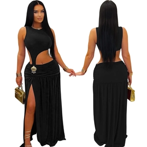 Detail of a black sleeveless cut-out maxi dress with a high slit and open waist design