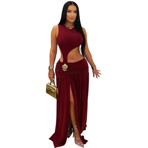 Detail of burgundy halter crop top and high waist side slit skirt with shell buckle