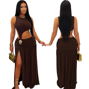 Detailed view of dark brown two-piece maxi dress with side slit and gold shell accent