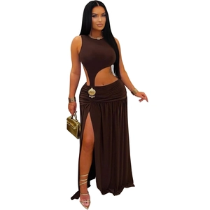 Detail of chocolate brown sleeveless crop top with shell accent and side slit skirt