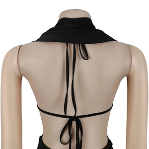Detail view of the backless halter top with cross-tie strings and elastic knit fabric