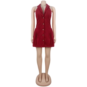 Detailed view of wine red halter dress featuring a suit collar and golden buttons