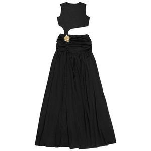 Detail of black sleeveless dress featuring side waist cutout and golden shell ornament