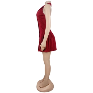 Detail view of burgundy halter neck pleated dress with tuxedo lapel on a mannequin