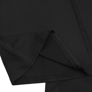 Macro detail of the double-needle stitching and fine knit fabric on these black pants