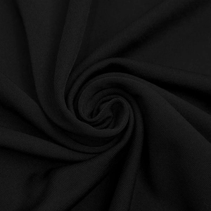Primo piano del tessuto a costine nero con trama fine e materiale elastico di qualità