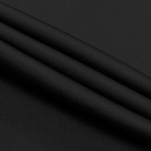 Detail shot of black fine knit fabric texture with elegant folds and subtle sheen
