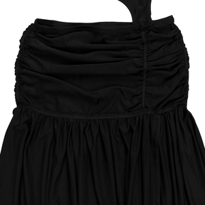 Close-up detail of black ruched knit fabric texture and elegant pleated dress stitching