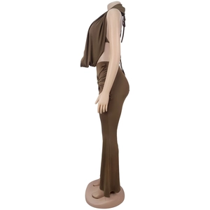 Detail of the high-waisted flared trousers with side ruching from the brown two-piece set