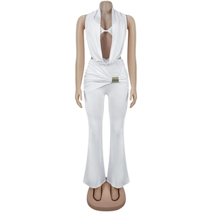 Detail of white deep V-neck halter jumpsuit with crystal buckle and flared trousers