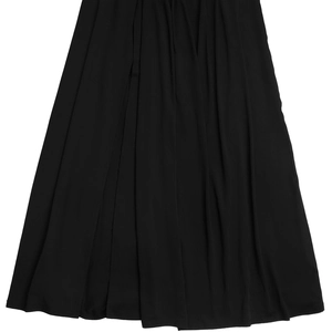 Detail of elegant black pleated skirt hem showing high-quality chiffon fabric texture