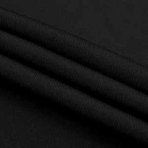 Close-up of black ribbed knit fabric texture showing vertical stripes and elastic material