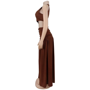 Detail view of brown two-piece set featuring a cropped top and side-ruched maxi skirt