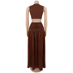 Detail view of brown two-piece set featuring cropped tank top and ruched high-waist maxi skirt