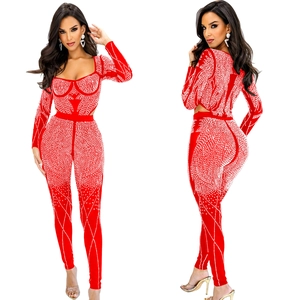 Front and back view of red mesh jumpsuit with sparkling rhinestone geometric patterns
