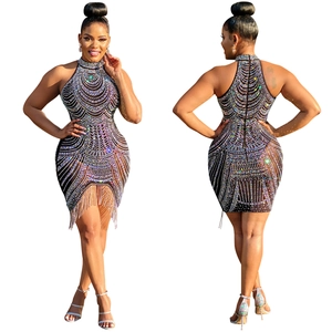 Front and back view of a black halter dress with sparkling rhinestones and fringe detail