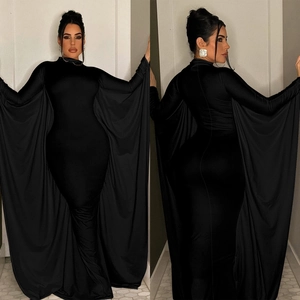 Elegant black evening gown with large cape sleeves and high neck floor-length silhouette