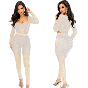 Detail view of pink mesh jumpsuit with sparkling silver rhinestones and open back design