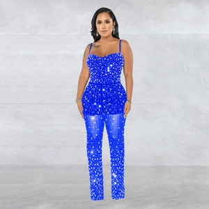 Detail of royal blue rhinestone jumpsuit featuring thin straps and slim fit design