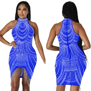 Detail of royal blue sleeveless halter dress with radiant rhinestones and silver fringe