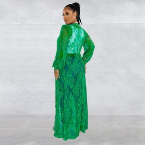 Detail of emerald green lace maxi dress showing floral texture and lantern sleeve back view