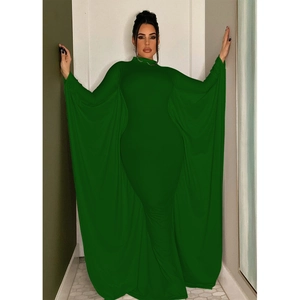 Detailed view of dark green bodycon maxi dress with elegant batwing cape sleeves